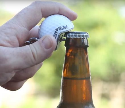 Golf ball bottle opener